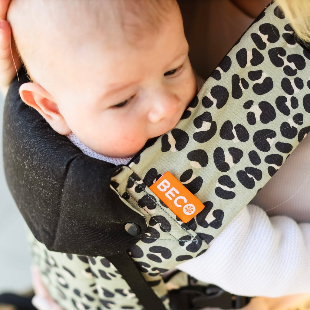 Close up of the Beco Gemini baby carrier in jade leopard pattern