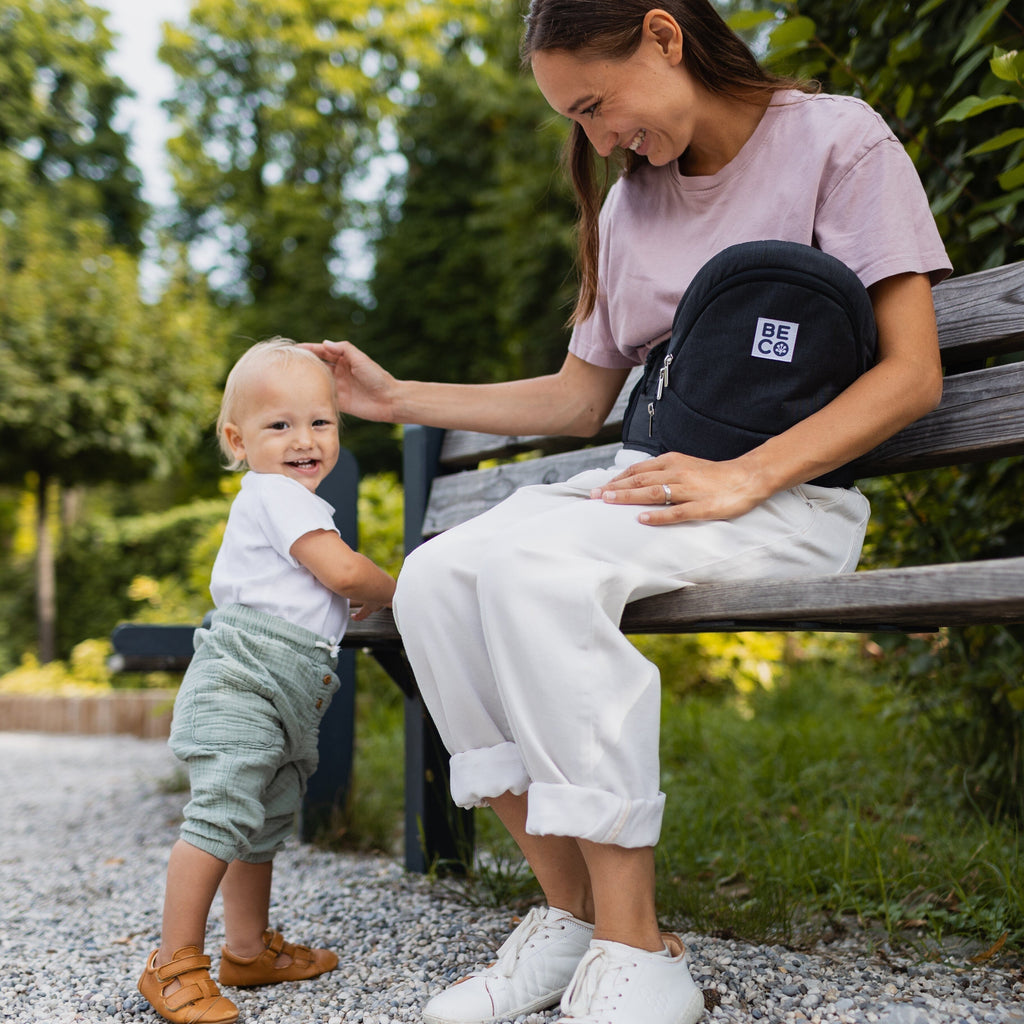 Beco Gemini Hip Seat Baby Carrier in black, ergonomic design for newborns to toddlers, featuring 4 carry positions and even weight distribution for all-day comfort.