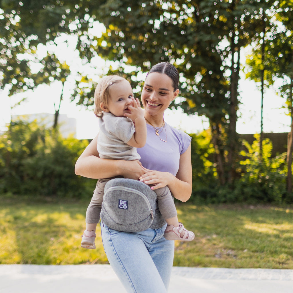 Beco Gemini Hip Seat Baby Carrier in Gray, ergonomic design for newborns to toddlers, featuring 4 carry positions and even weight distribution for all-day comfort.