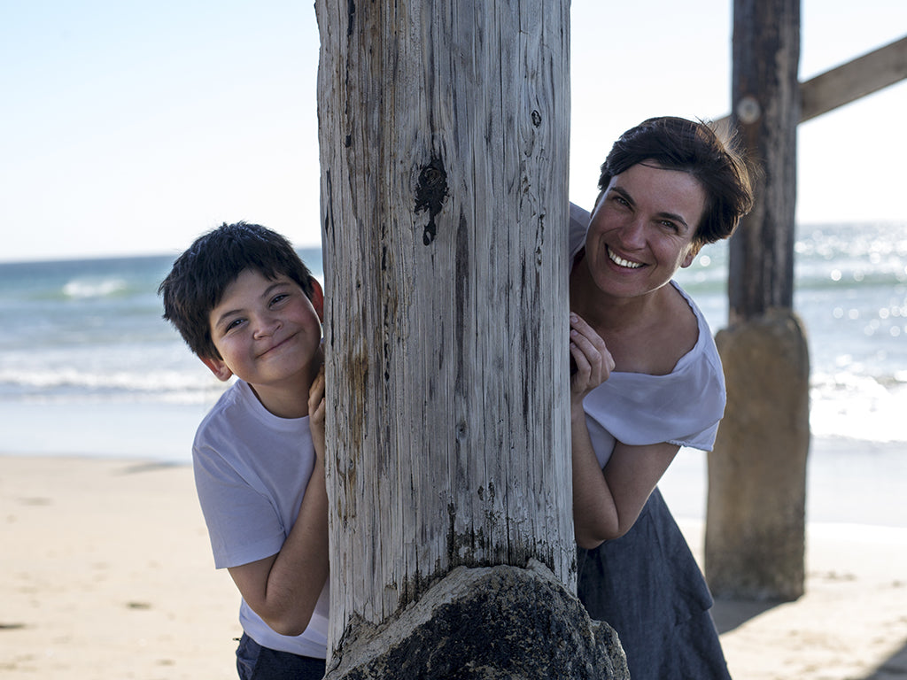 Gabby the founder of Beco with her son Duke on the beach