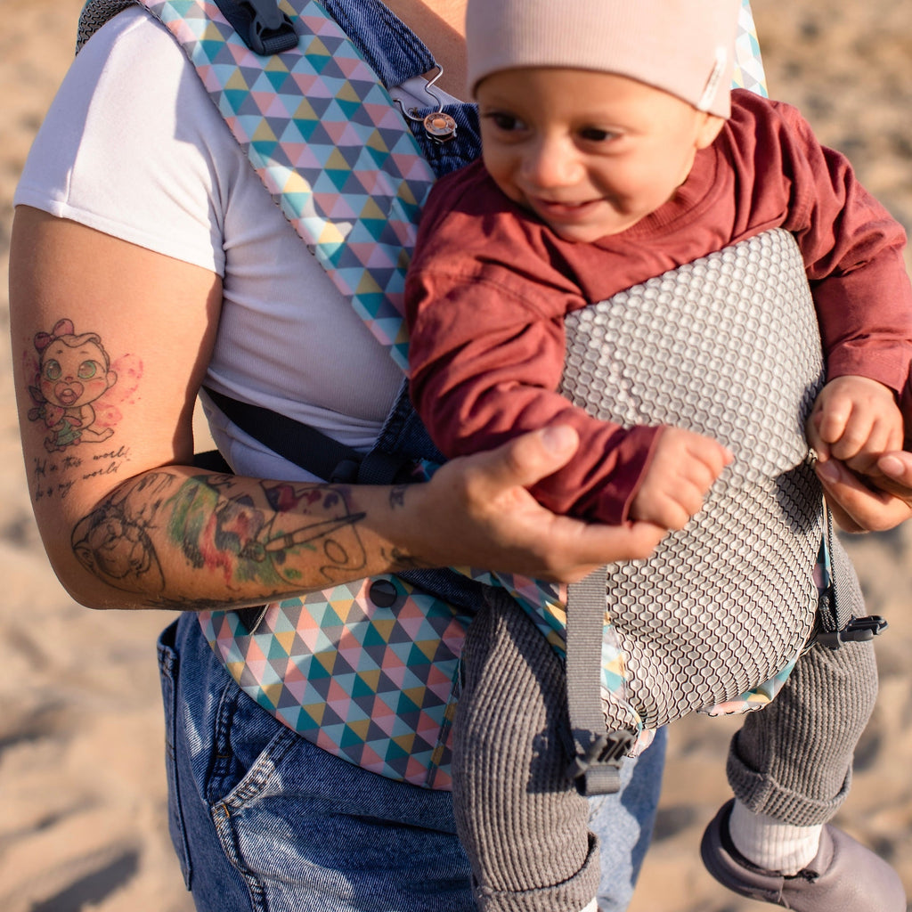 Baby front carry facing out in the Beco Gemini Cool Mesh in Grey Geometric pattern
